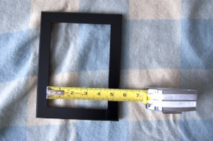 DIY framed shelves measuring the frame