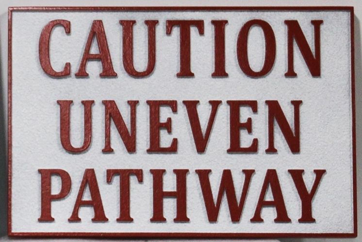 T29467 - Carved Raised Relief  and Sandblasted  HDU "Caution Uneven Pathway"  Sign.