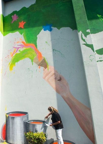 Woman painting Mural