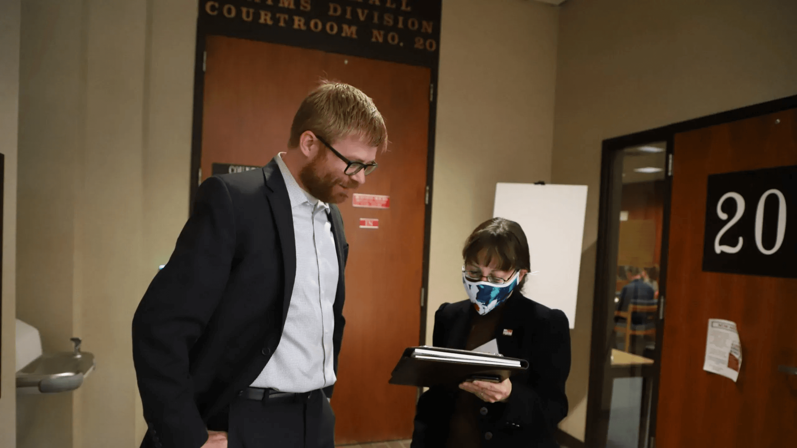 Legal Aid of Nebraska attorney Scott Mertz and Board member Amy Van Horne prepare for court