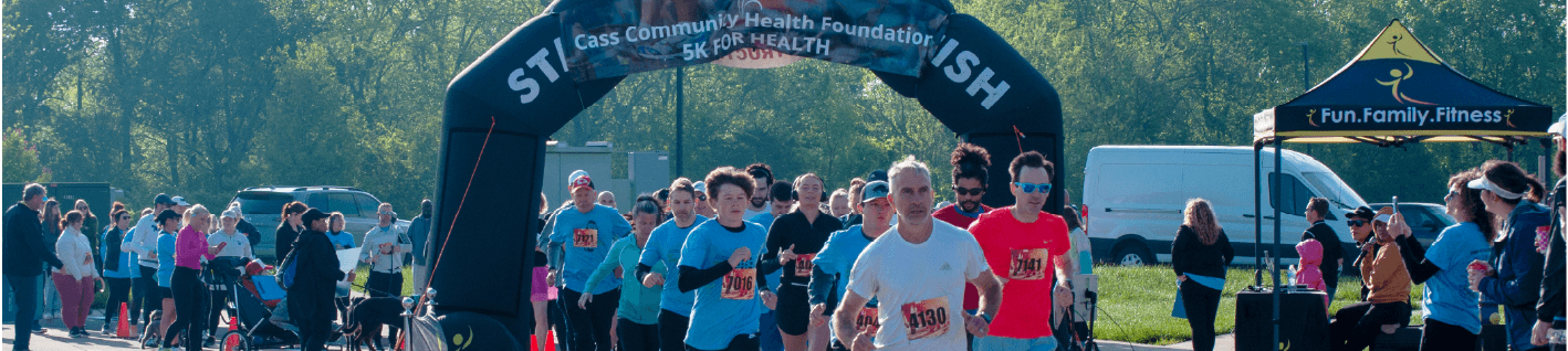 group of runners and walkers at a race starting line