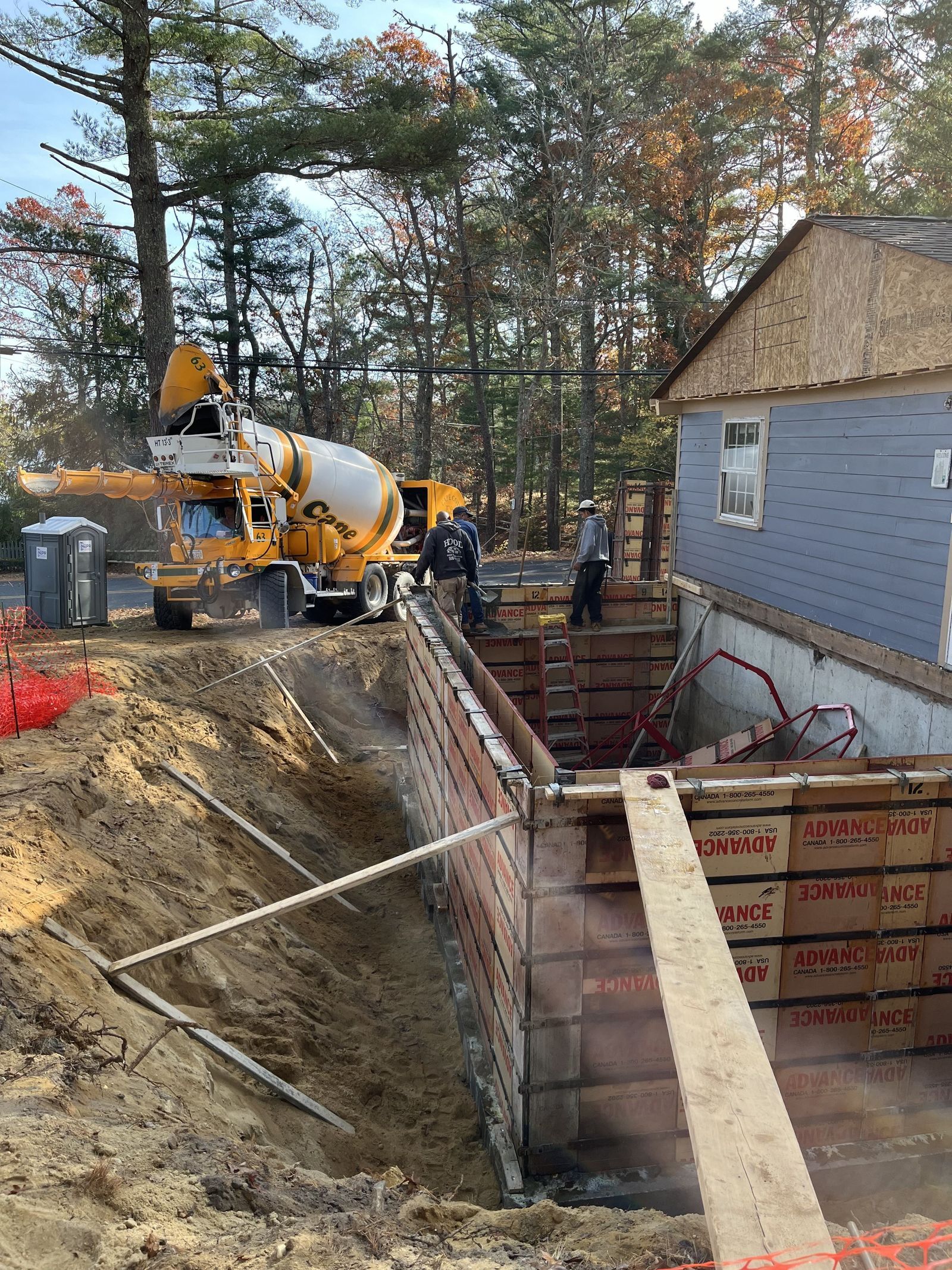 Side of house with foundation poured for a small addition on house