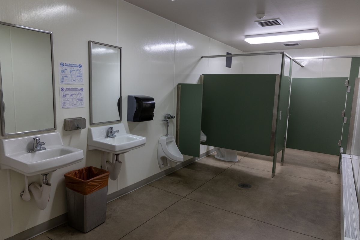 An image taken inside of the multi-stall men's restroom in the Red Barn.
