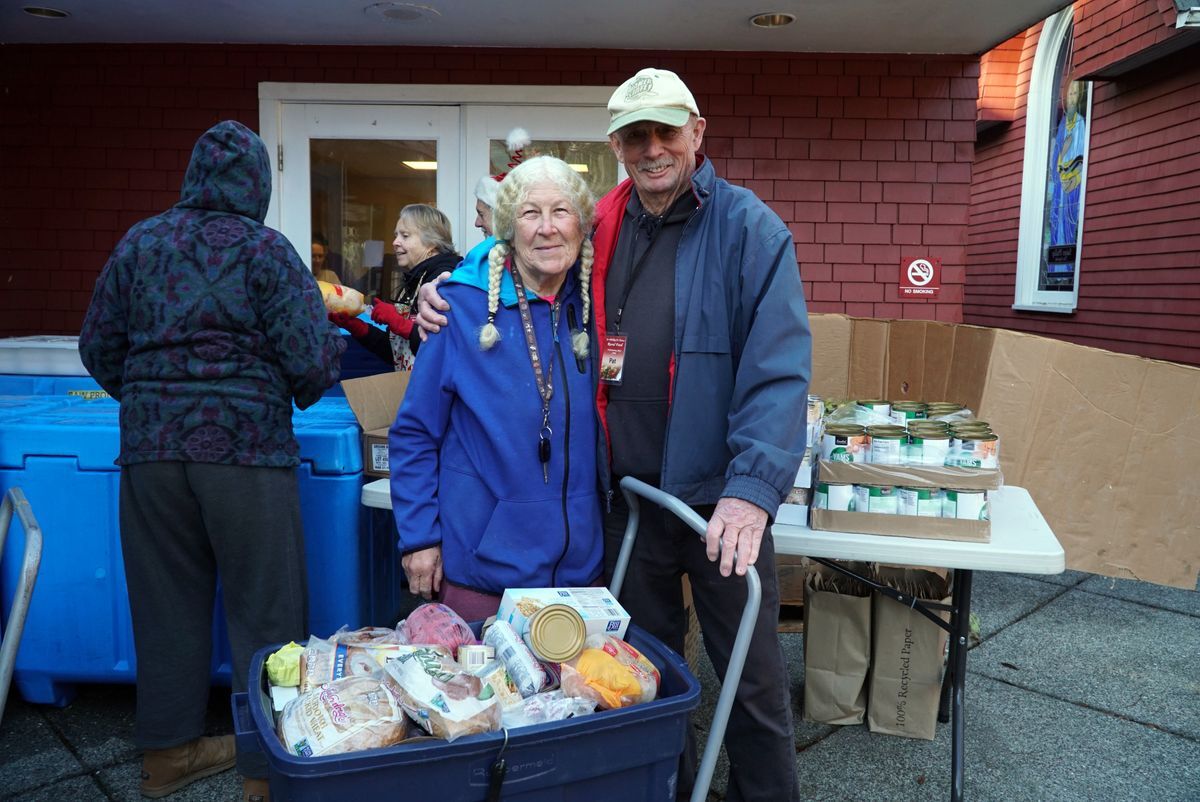 Senior couple with a bin full of fresh food