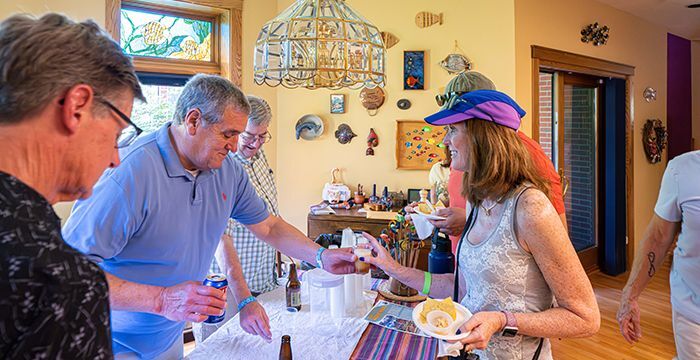 People at the 2023 Beer Walk getting more beer and snacks. 