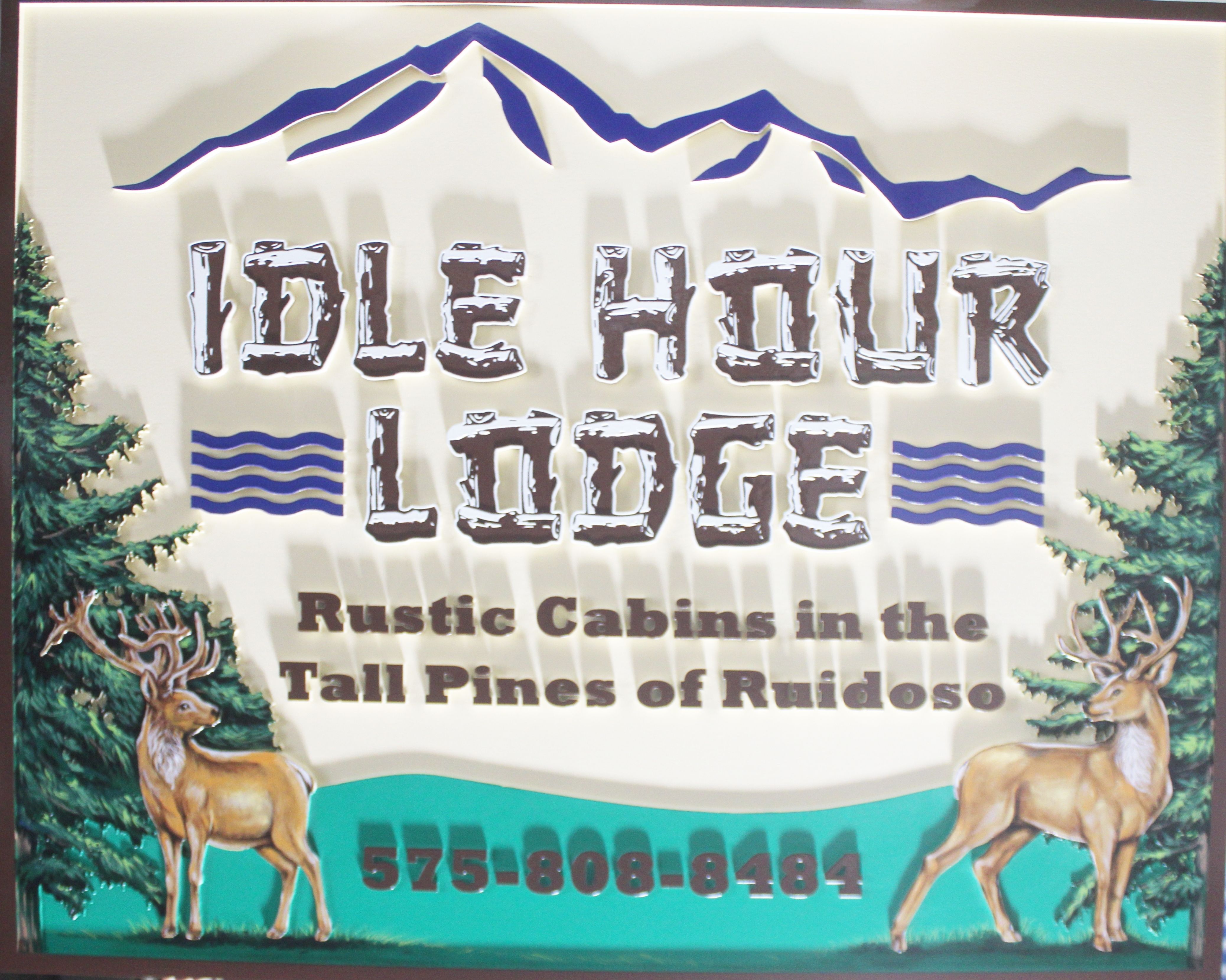 T29182 - Carved 2.5-D Multi-level HDU Sign for "Idle Hour Lodge" featuring Two Buck Deer, Pine Trees, a Mountain Range, and Log Text as Artwork