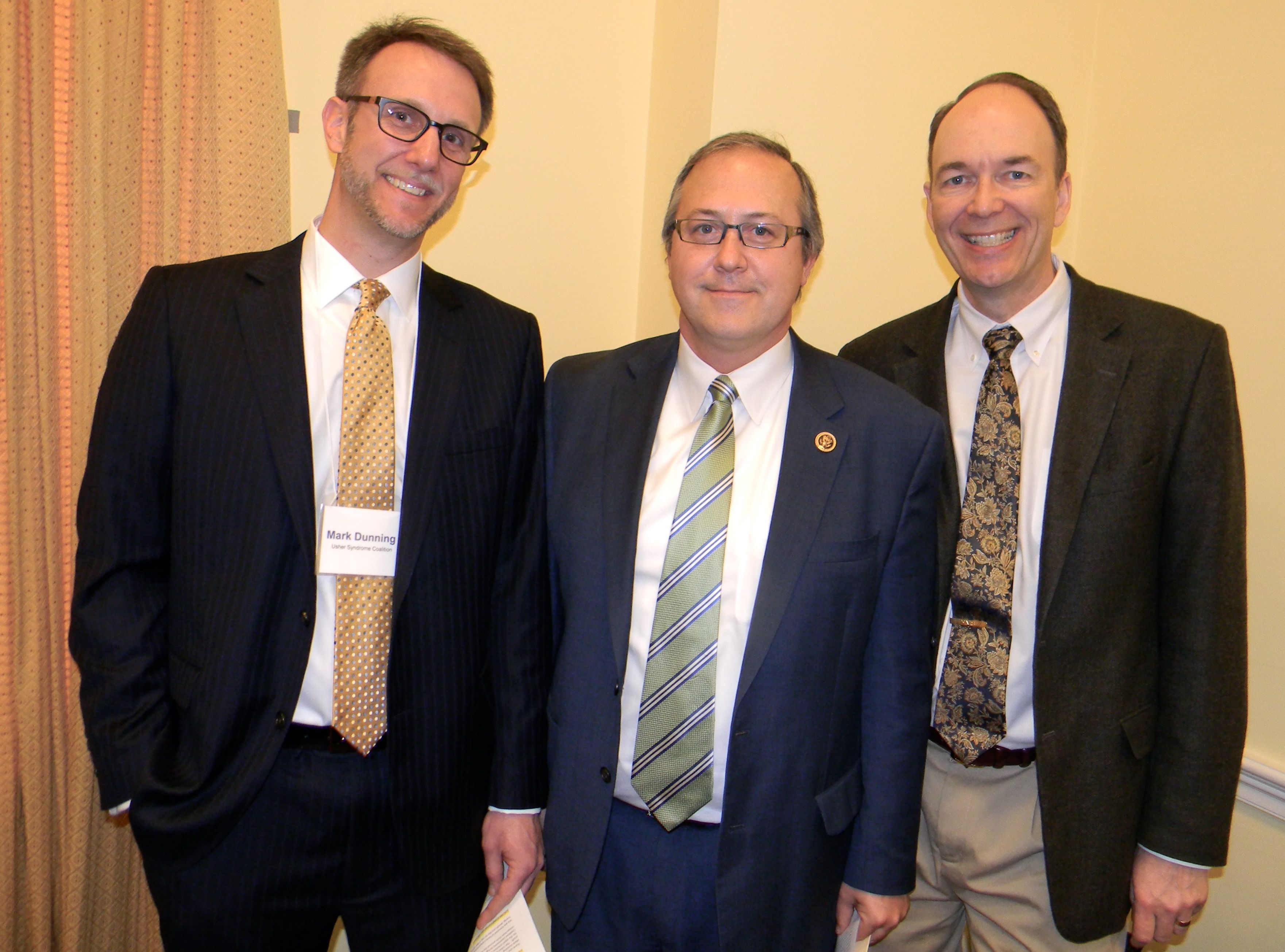 A picture of Mark Dunning, Congressman David Young, and Dr. Edwin Stone 