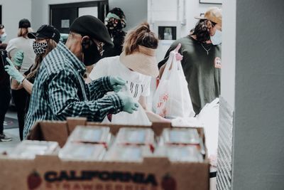Volunteers Bagging Groceries to Support the Community