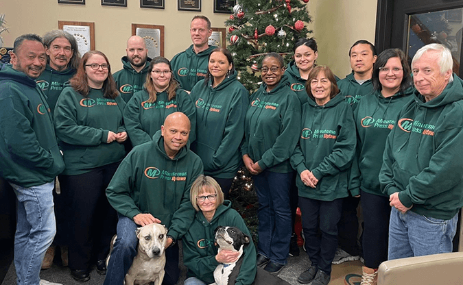 Minuteman Press Uptown employees celebrating Christmas and the Holiday season