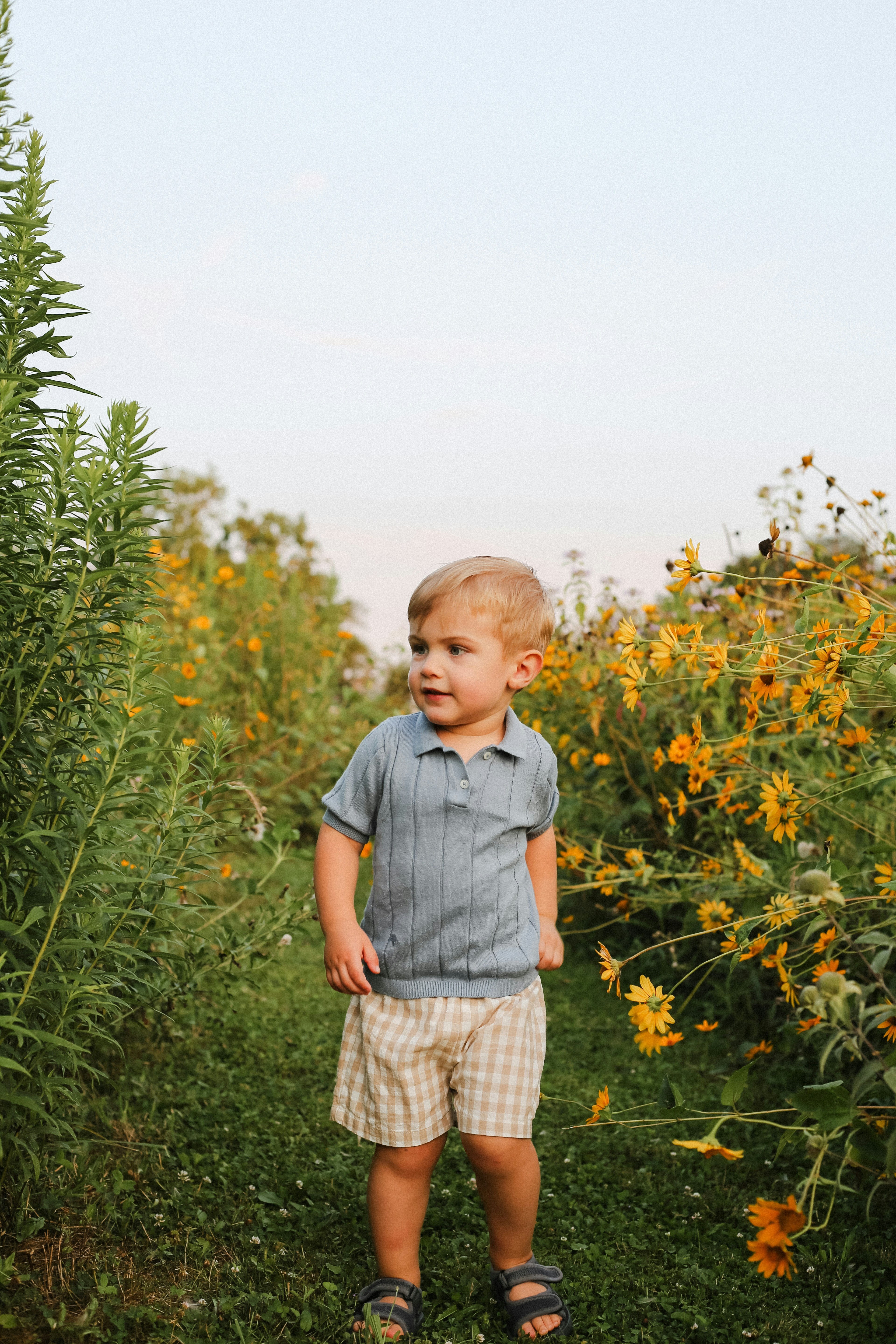 young boy in an orange jacket