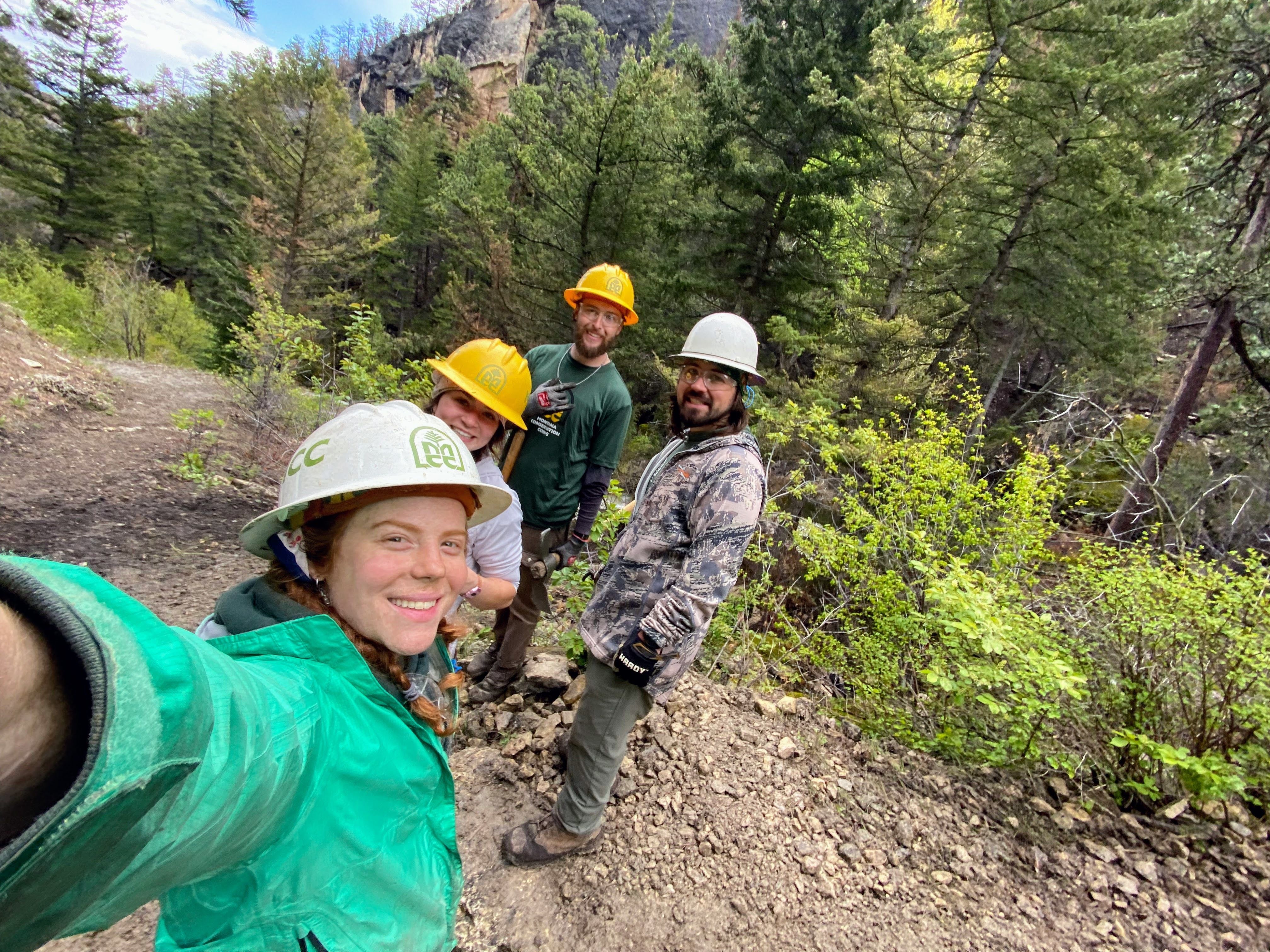 A crew leader takes a selfie of the crew.