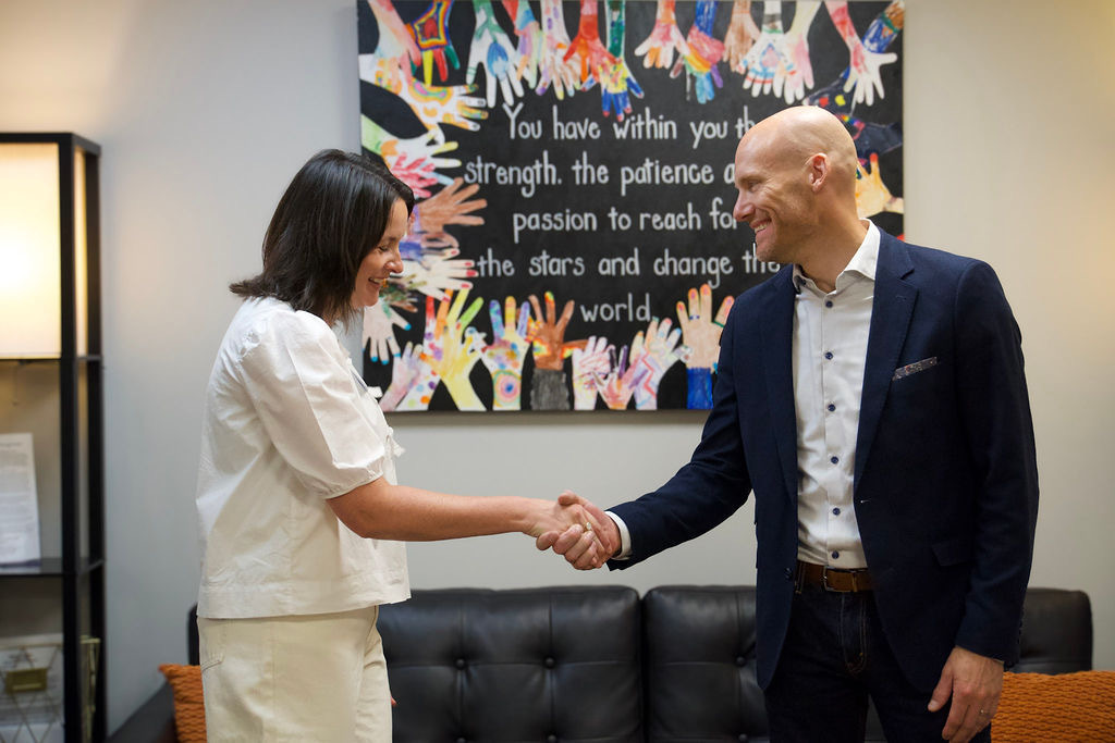 Sarah Berndt, Executive Director of Canopy Center, and Josh Gustafson, Wisconsin Market President for Dean Health Plan by Medica, celebrate the $152,000 investment supporting expanded whole-family healing through Canopy Center’s Oasis Program.