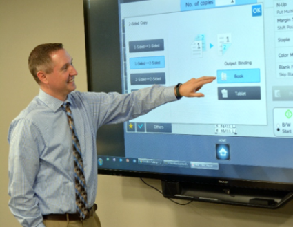 Man Pointing at Screen