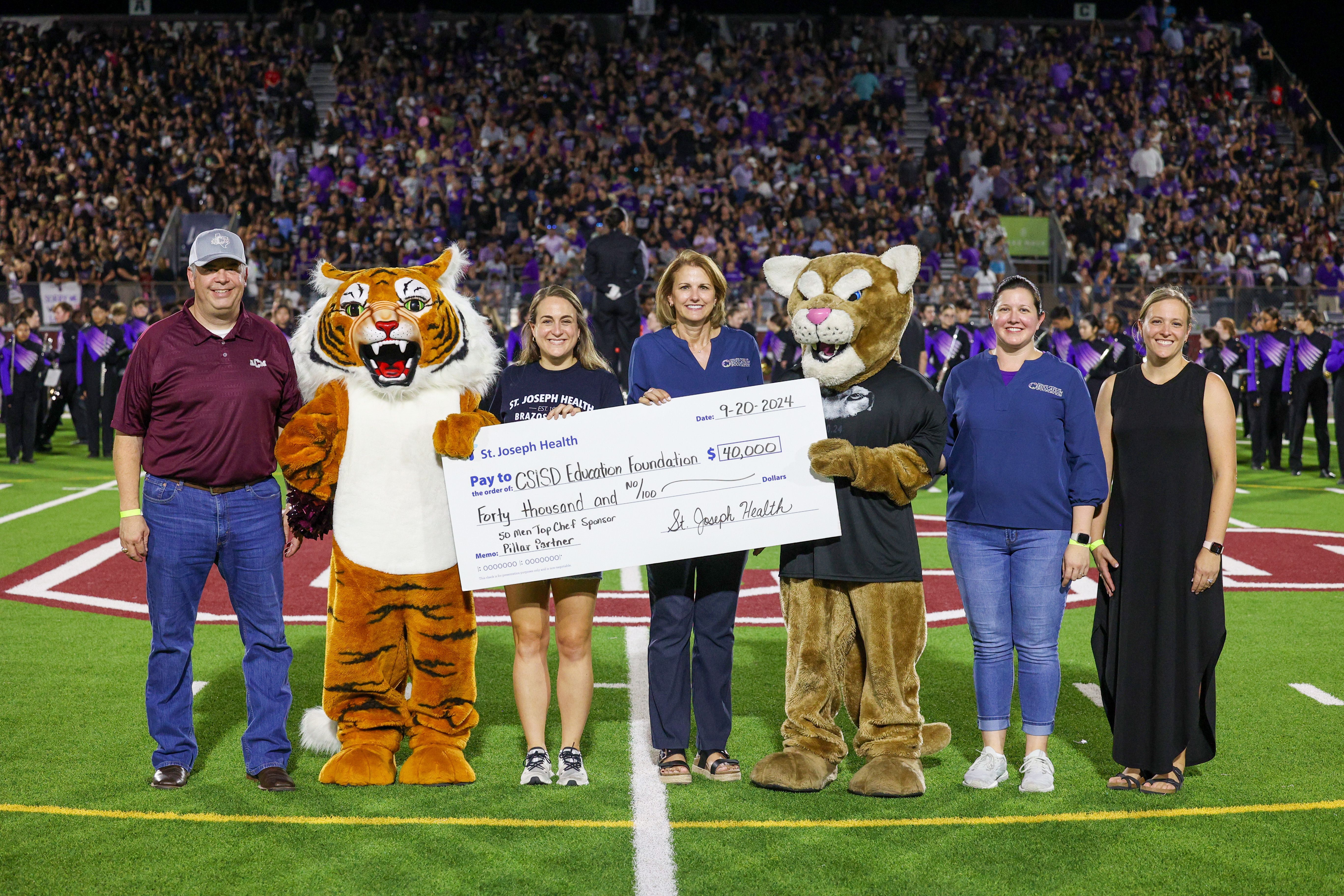 St. Joseph Health presenting a check to the Education Foundation