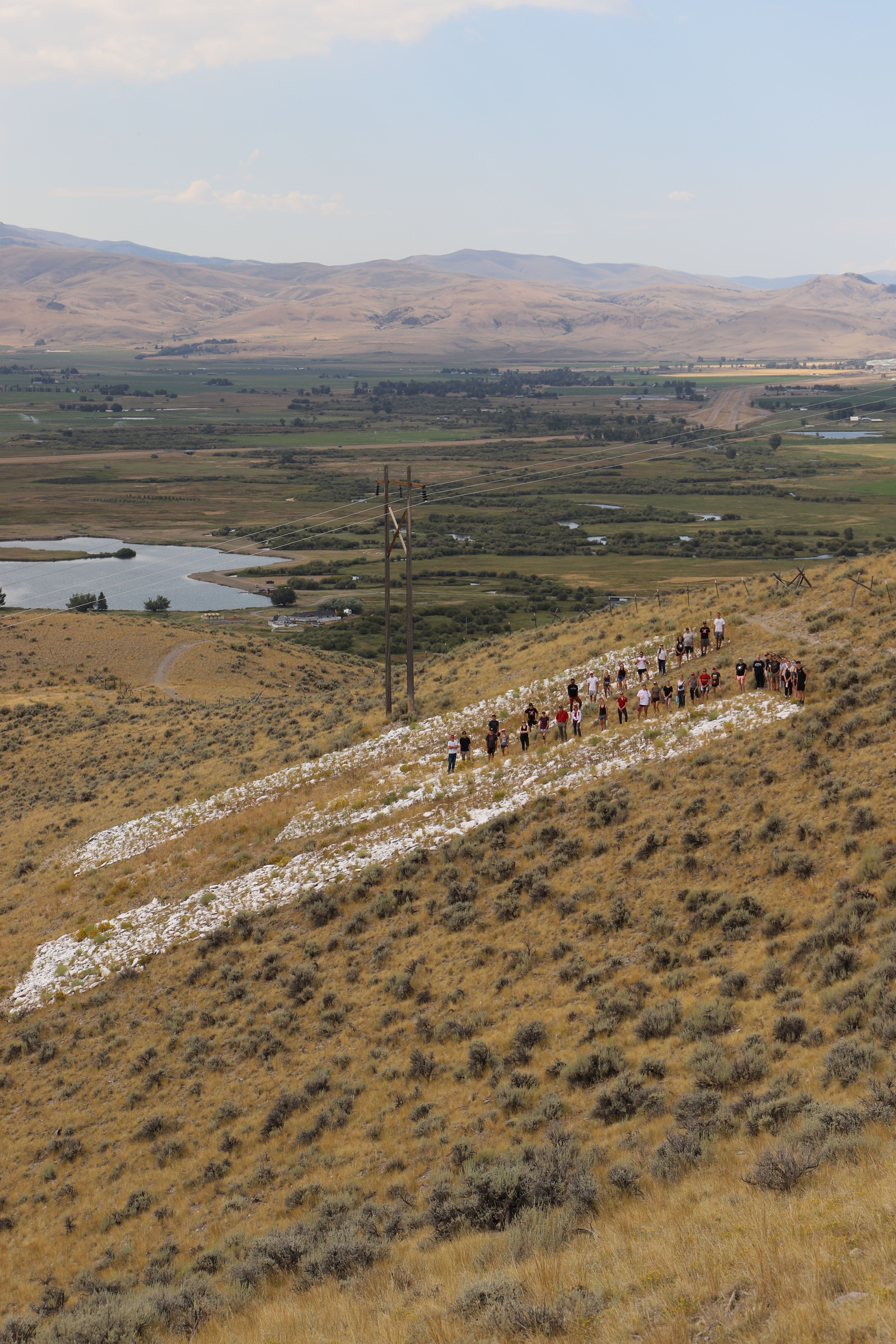 Person holding paper with the word "thankful" cut out