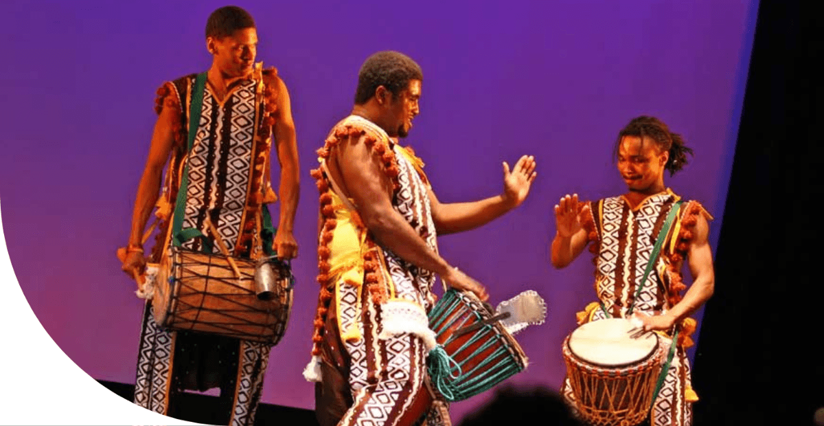 three men drumming 