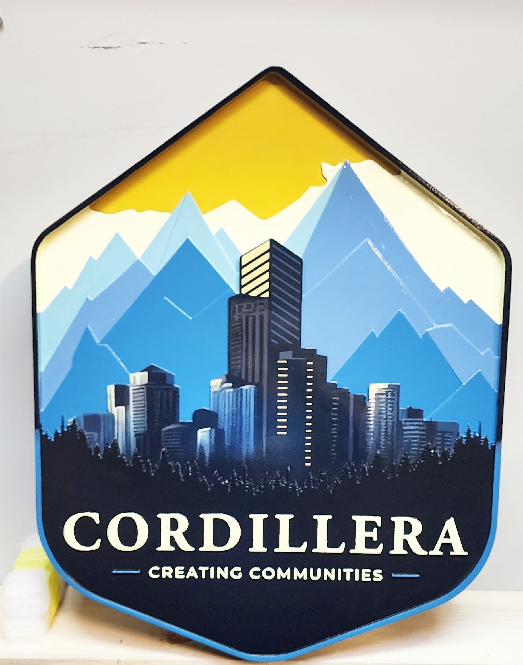 K20231 - Carved 2.5-D Multi-level   entrance sign for the "Cordillera" Residential Community, with City Skyscrapers and Mountains as Artwork