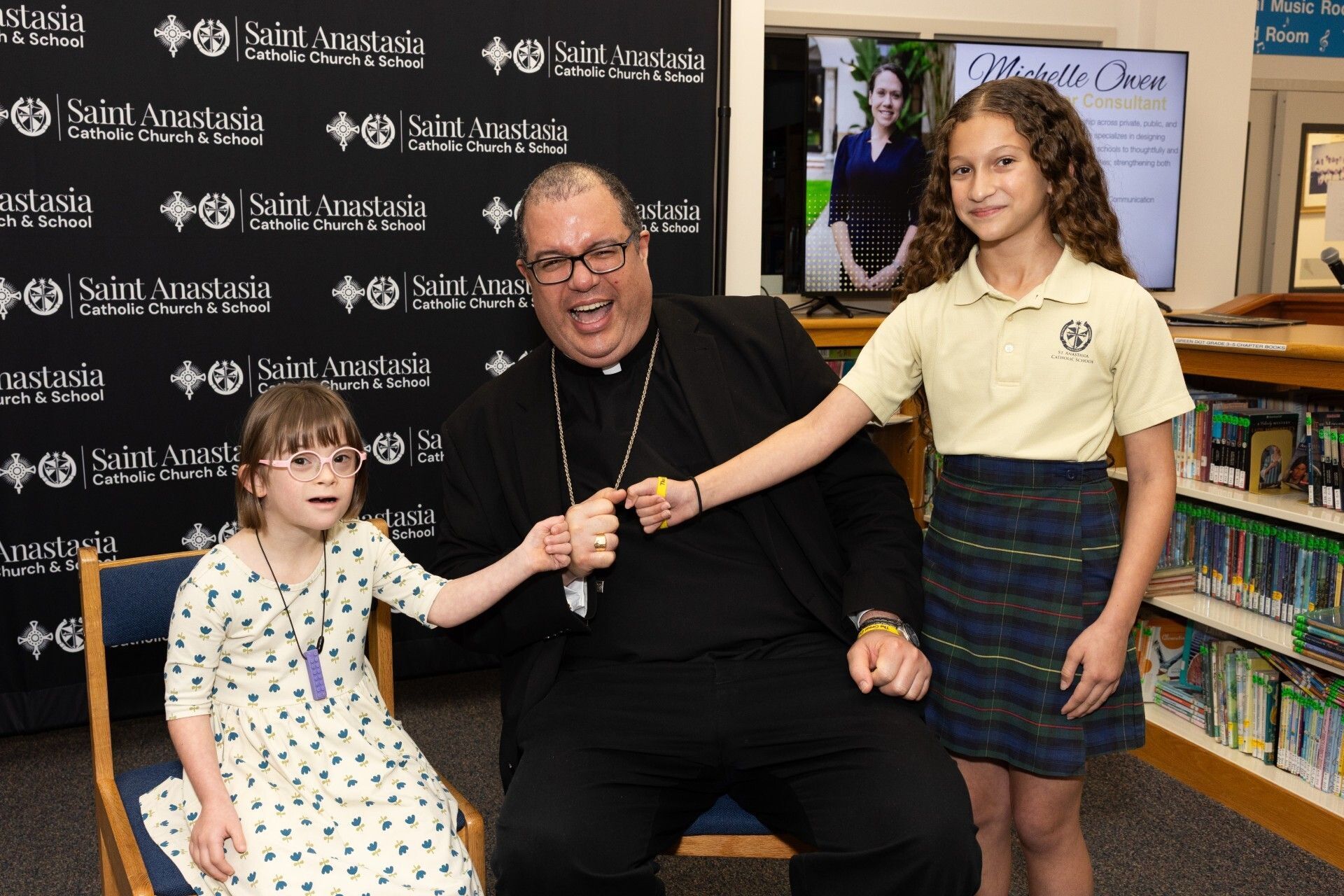 Adelina Bowes and Penelope Bowes with Bishop Manuel de Jesús Rodríguez, Bishop of Palm Beach