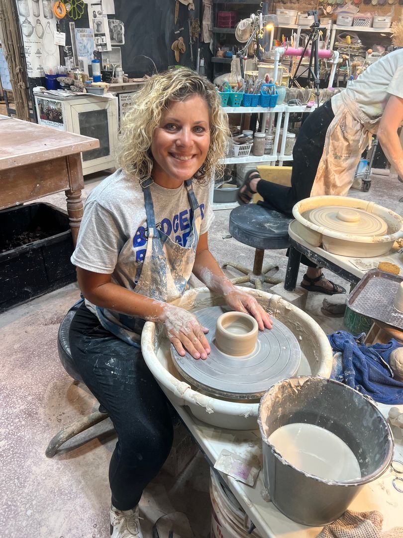 BMS Art Teacher Amy Blanchard at pottery wheel throwing class.