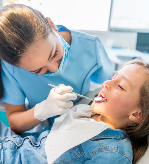 Young girl getting a dental exam