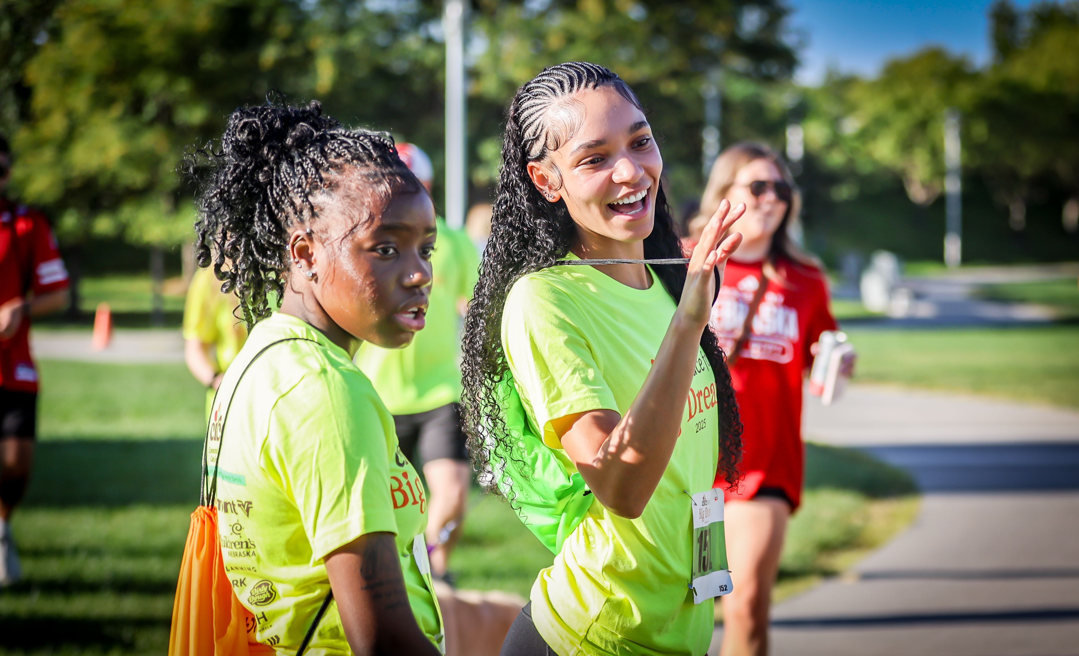 Two friends laughing together at the Race for Big Dreams