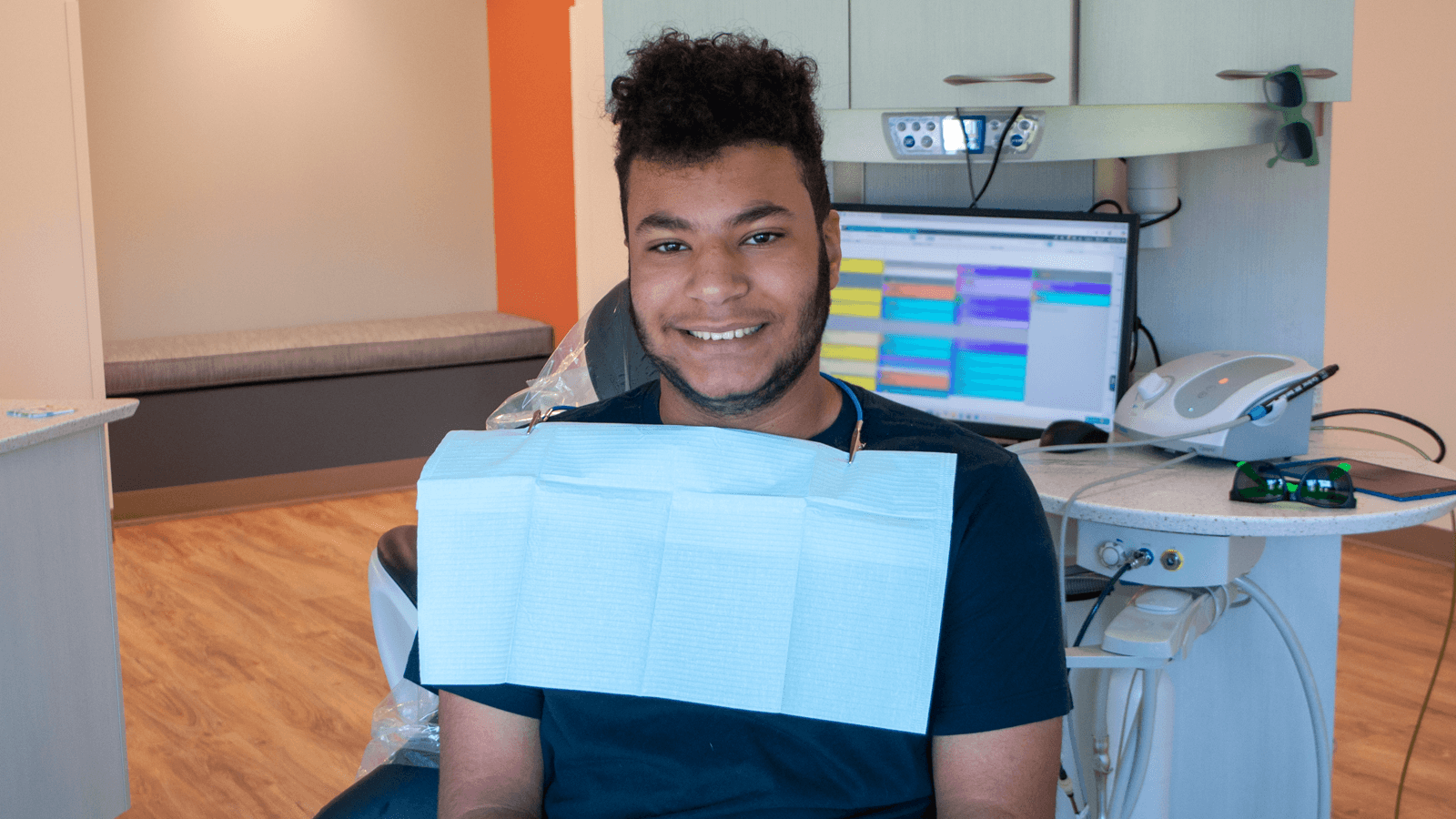 young man smiling in dental chair