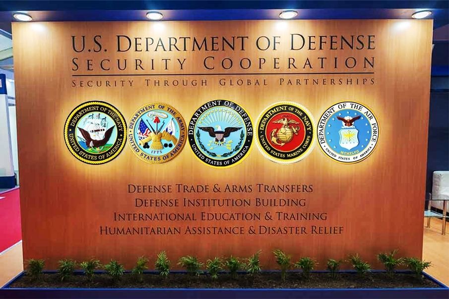 IP-1271 - Five Service Seals Mounted on an Interior Wall in  the Department of Defense Security Cooperation Headquarters