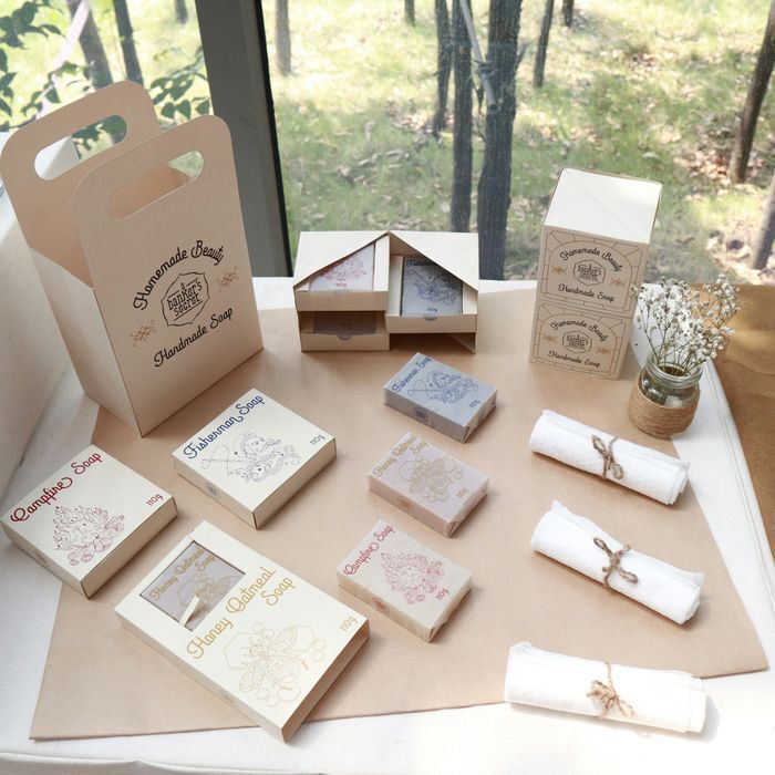 Sustainable product packaging collection showcasing custom kraft paper boxes and die-cut folding cartons for handmade goods