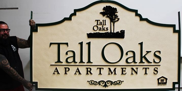 K20381  - Carved High-Density-Urethane (HDU)  Entrance sign for the "Tall Oaks Apartments", 2.5-D, with Oak Trees as Artwork 