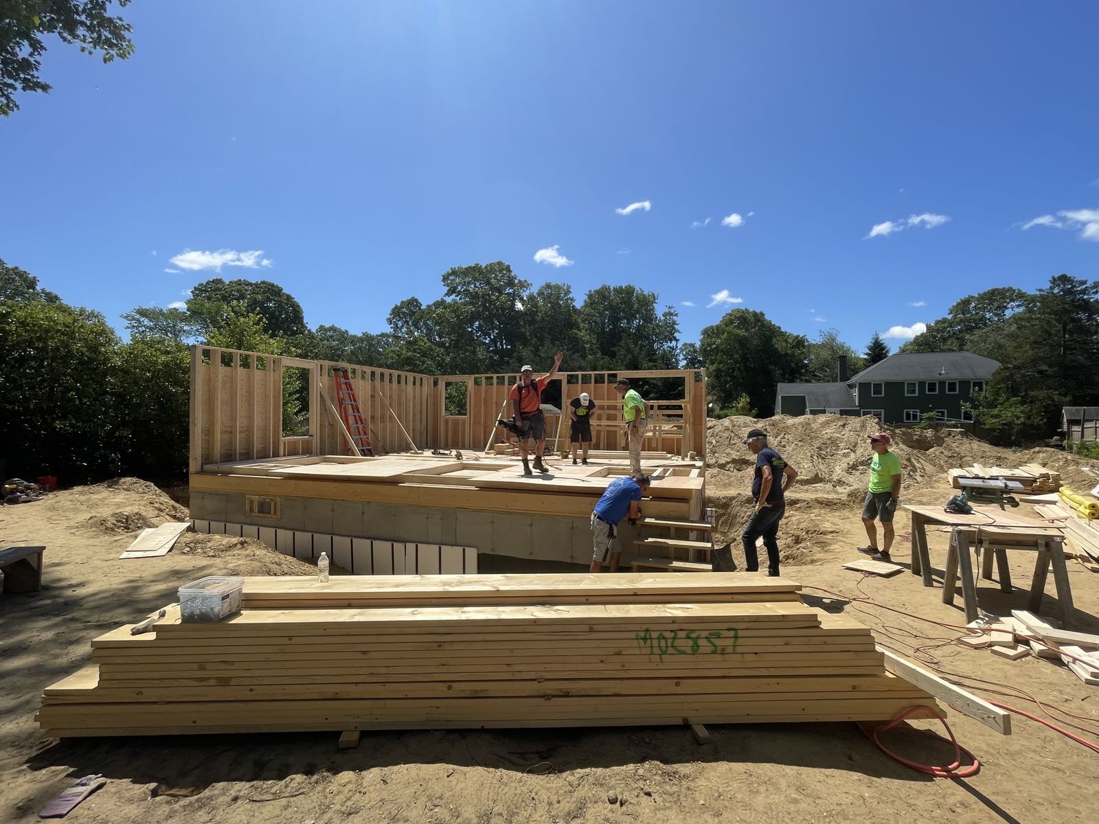 Photo showing foundation of a new house with some exteriors walls built 