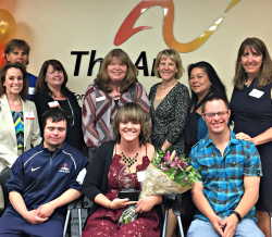 Board members, volunteers and staff celebrate Sara's achievements.