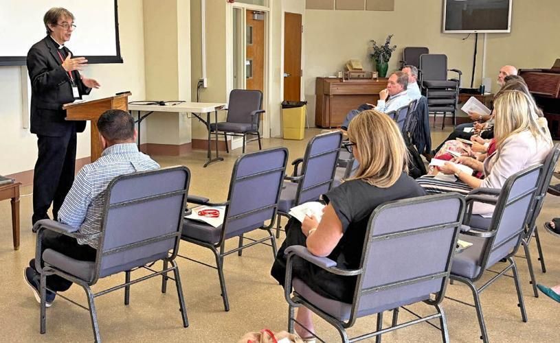Former classroom teacher Father Serge Dubé leads a session for principals and presidents at Our Lady of Florida Spiritual Center