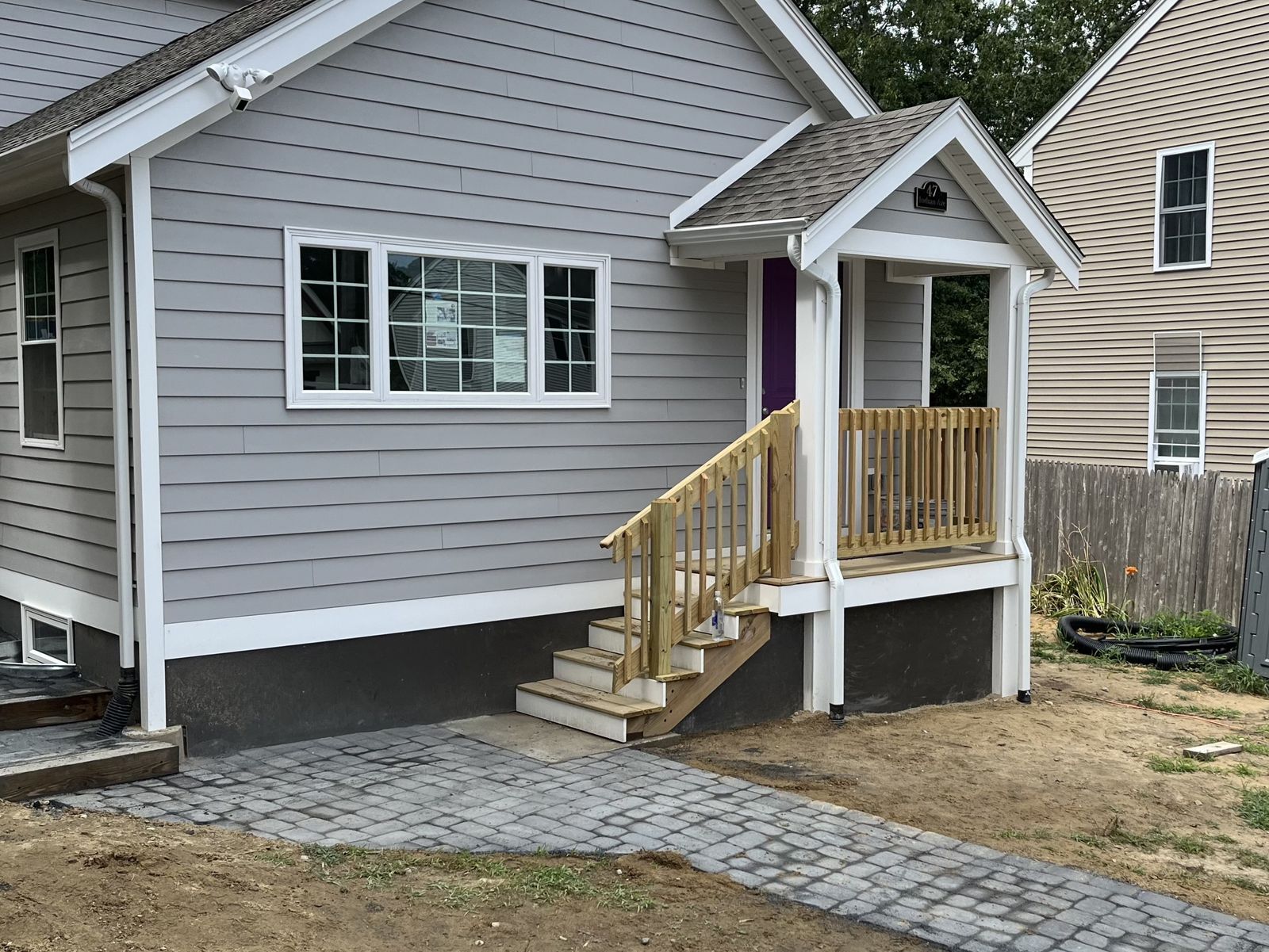 Exterior of new home with stone walkway