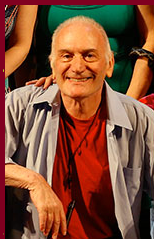 A picture of the founder of TBTB, Ike Schambelan. He is smiling and posing for the photo.