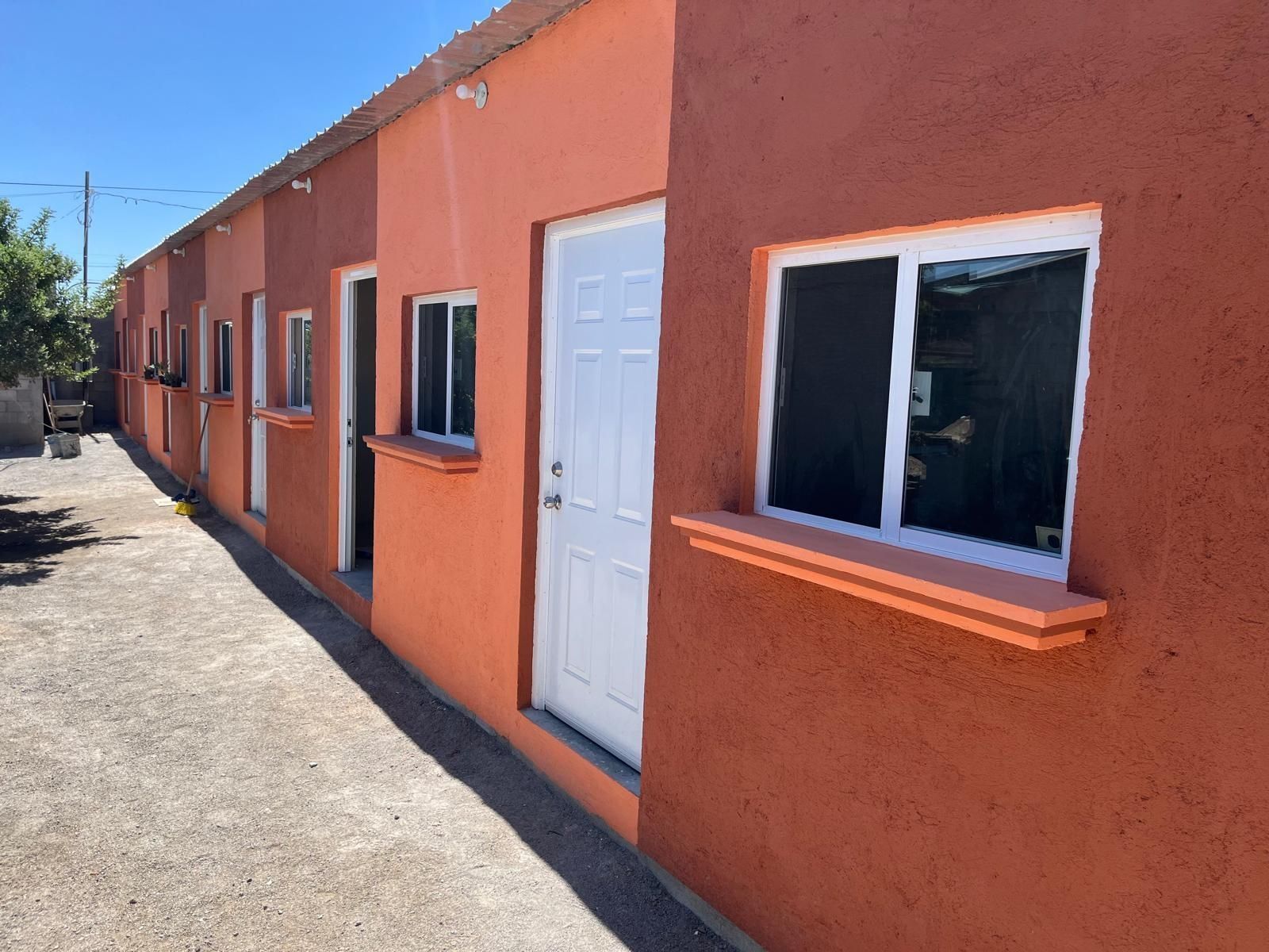 Newly constructed housing with paint buckets in front of them
