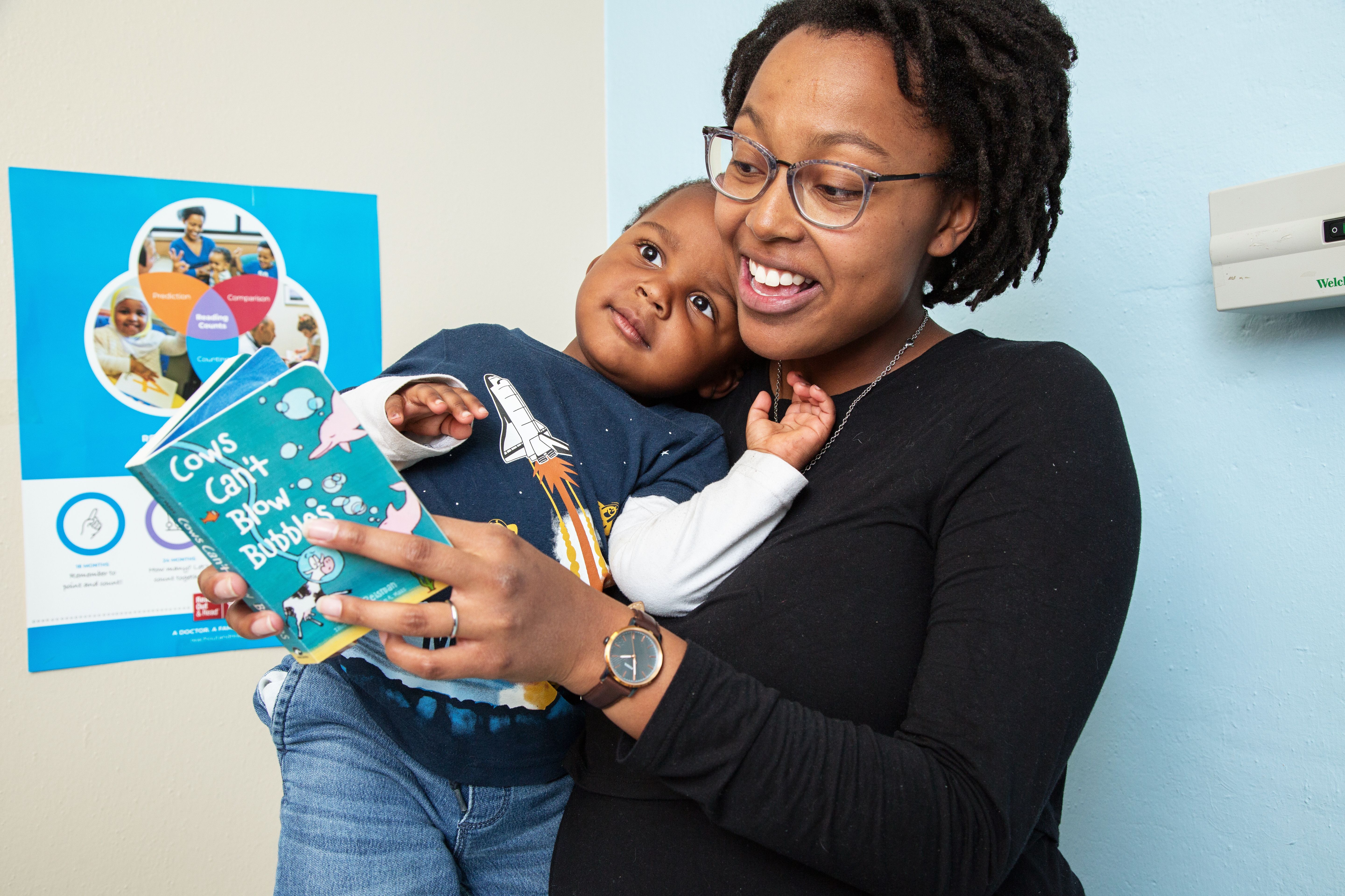 Toddler and mother read together