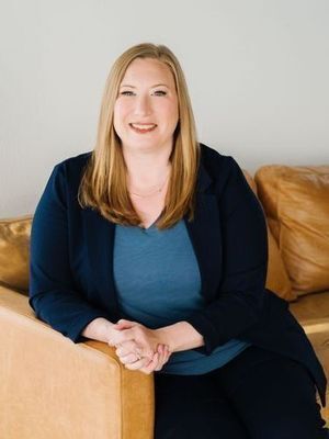 Amy Witt, woman sitting on couch