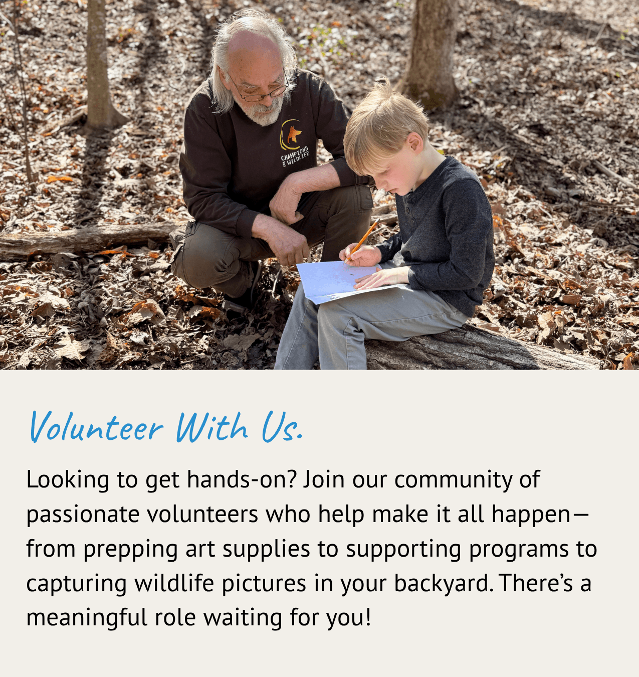 Volunteer assisting a student with their wildlife journal