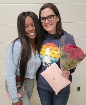 girl and woman posing with flowers