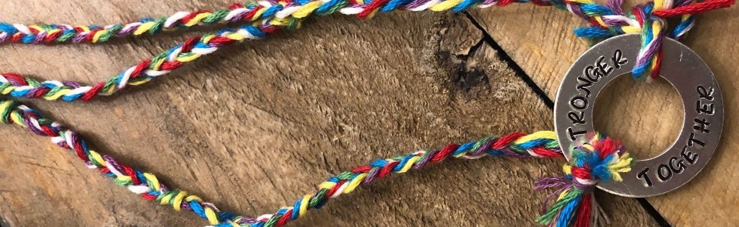 Group of ladies walking with the arms around each other