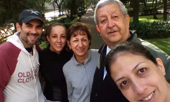 A picture of Dianna Velarde and four other people all smiling at the camera.