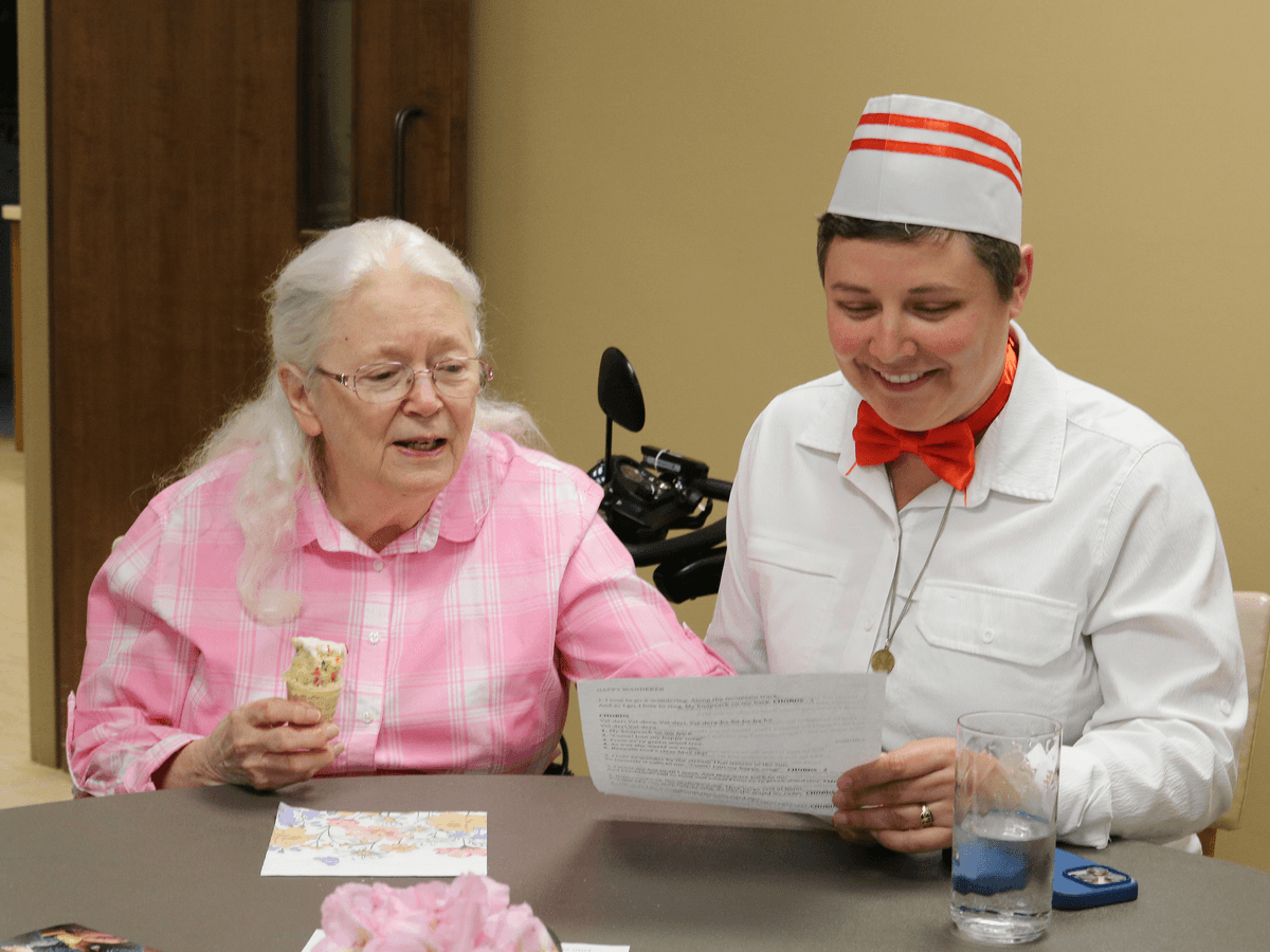 Sisters Jean and Val sing in between bites of cake ice cream cones.