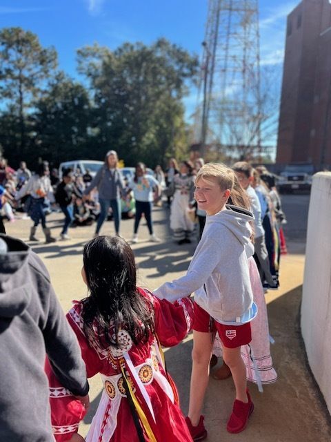 Student taking part in Choctaw dance demonstration