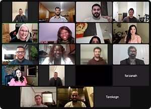 Many faces on a computer screen during a zoom session for an online class.