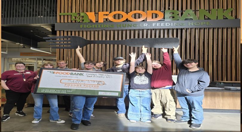 Students smiling and posing for a picture 