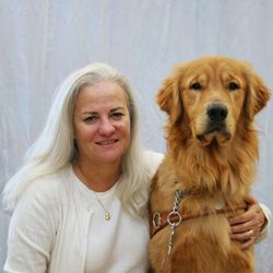 This is a picture of Moira Shea, with her guide dog