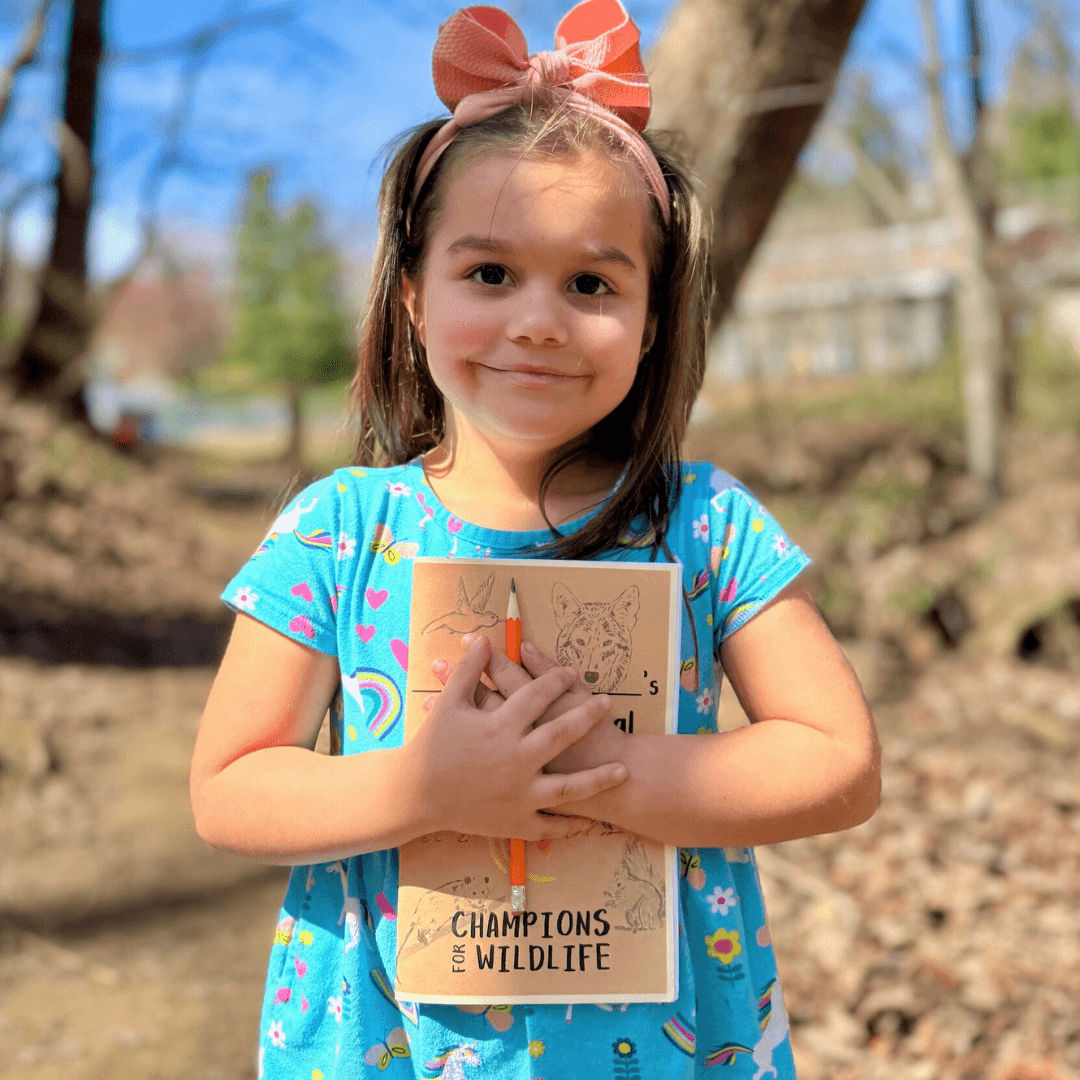 Excited student cherishes the journal from a Sunshine & Smiles kit
