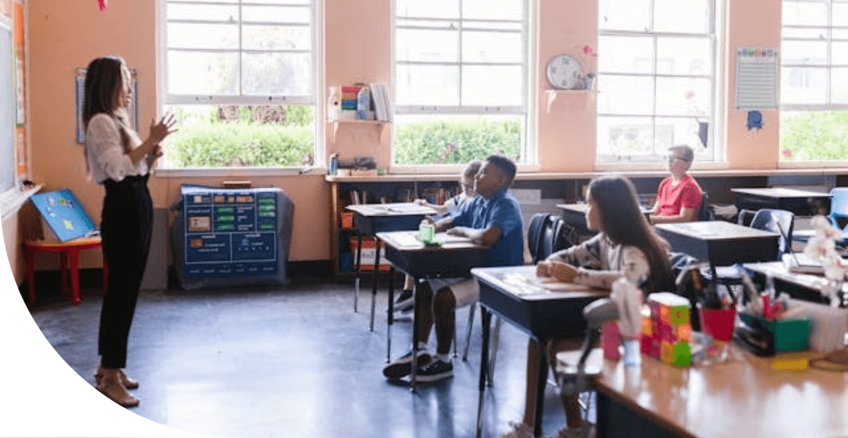 teacher in front of a classroom of kids