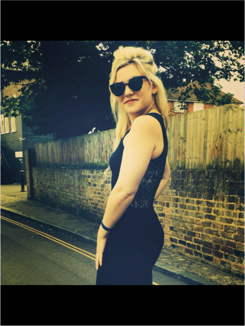 Photo of Molly Watt outside in a black dress and sunglasses