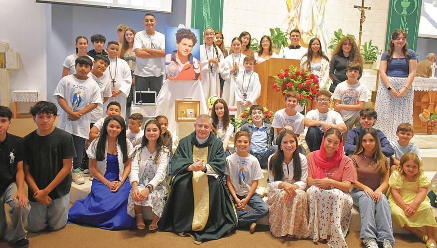 Junior Legion of Mary members and the St. Rita middle and high school youth ministry honored the canonization by gathering with Father Daniel Donohue after Mass.